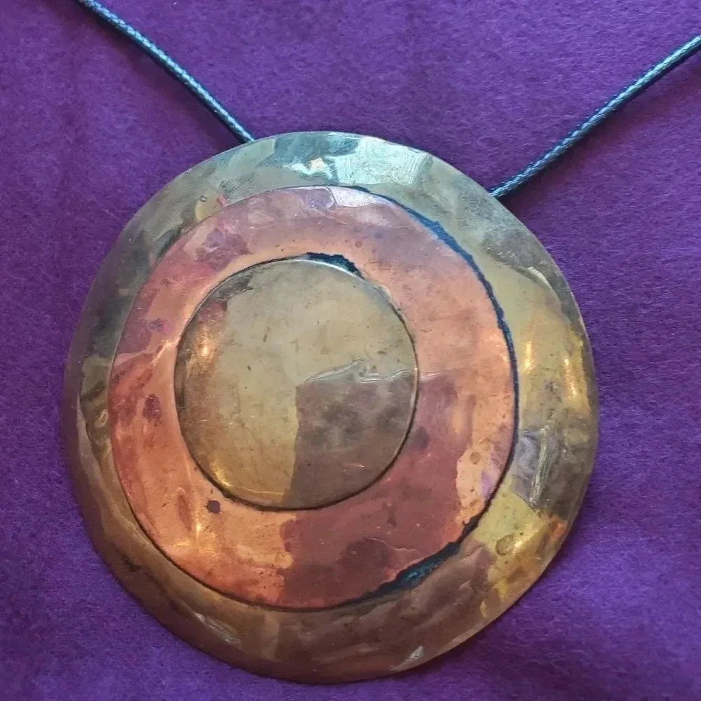 Bronze  two tone medalion on smooth pendent rope